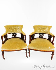 A pair of upholstered antique
